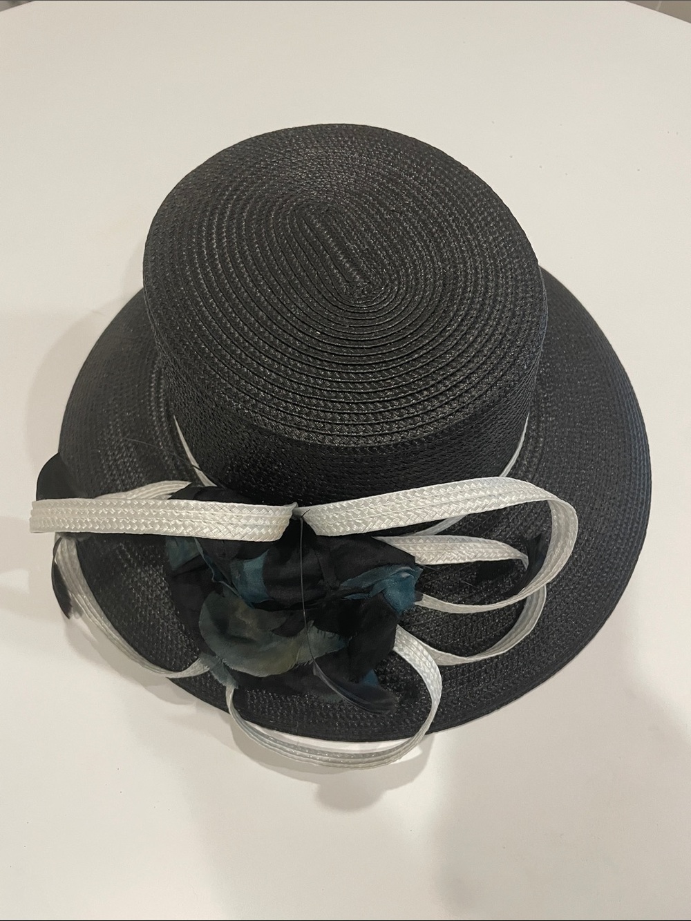 Black Straw Hat with White Band and Dark Floral Accent
